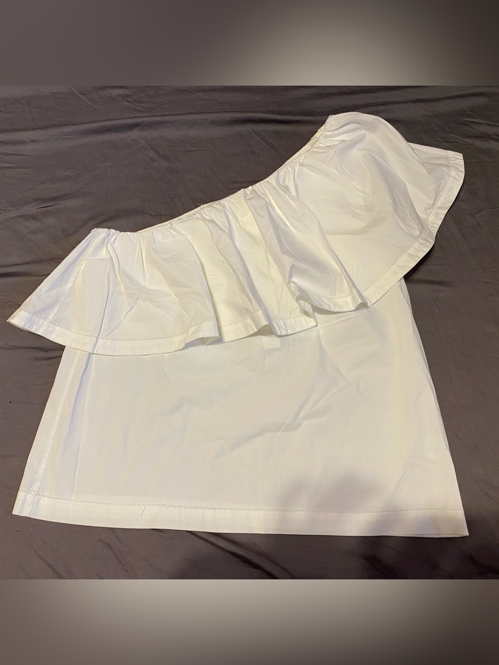 Trina Turk white one sleeved asymmetrical ruffle cotton blouse, size large NWT